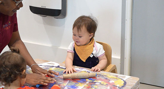 toddler playing at a nursery