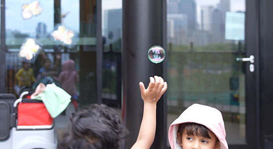 children playing with bubbles