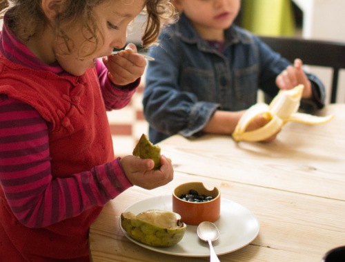 children eating food at nursery